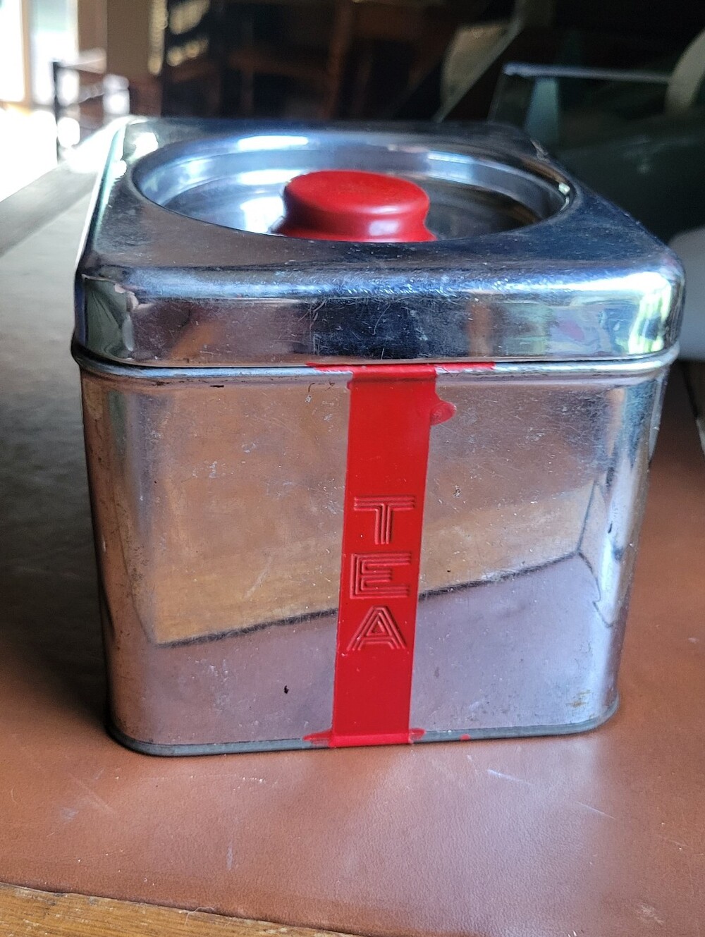 Lincoln BeautyWare chrome and red metal tea canister